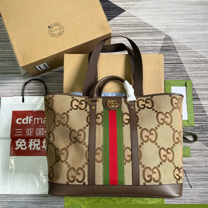 G*u*i shopping bags